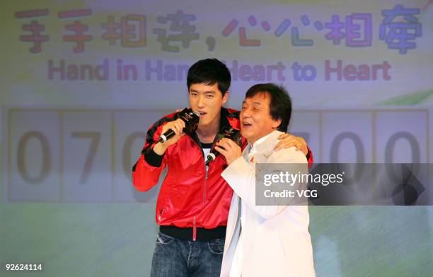 Movie star Jackie Chan and Chinese 110 meter hurdler Liu Xiang attend a charity party of 'Hand in Hand, Heart to Heart' on November 2, 2009 in...