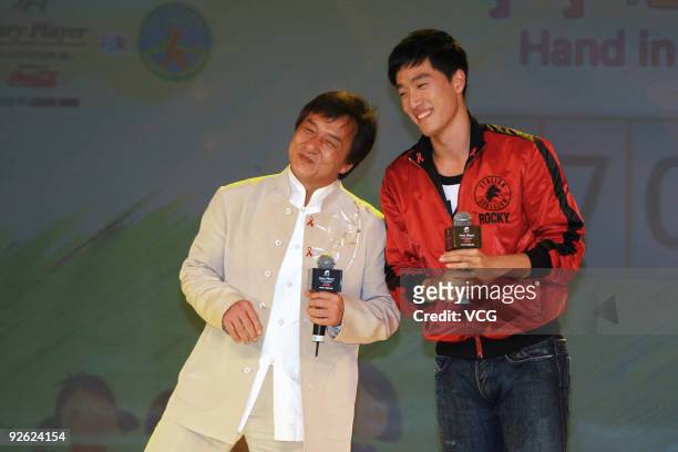 Movie star Jackie Chan and Chinese 110 meter hurdler Liu Xiang attend a charity party of 'Hand in Hand, Heart to Heart' on November 2, 2009 in...