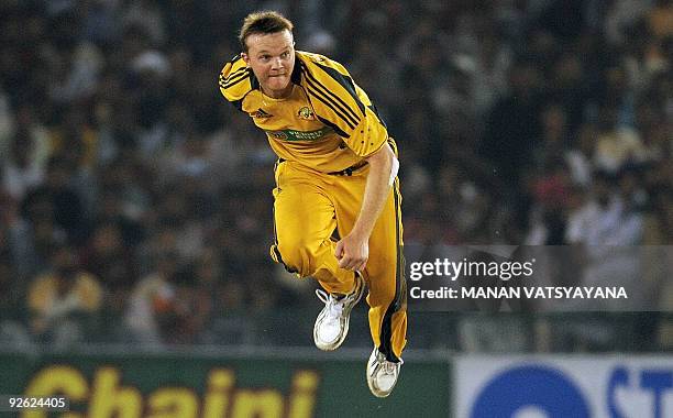 Australian Doug Bollinger bowls during the fourth One-Day International match at the Punjab Cricket Association Stadium in Mohali on November 2,...