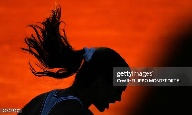 French Amelie Mauresmo gestures as she plays Italian Francesca Schiavone during the Fed Cup semi-final between Italy and France, 14 July 2007 in...