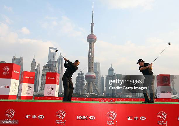 Tiger Woods and Phil Mickelson of the USA hit a shot into the Huangpu River during the the Official 2009 WGC-HSBC Photocall at the Shanghai Port...