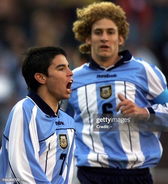 Forward of the Argentina soccer team, Javier Saviola , celebrates his team's first goal together with Fabricio Coloccini, who scored his team's third...
