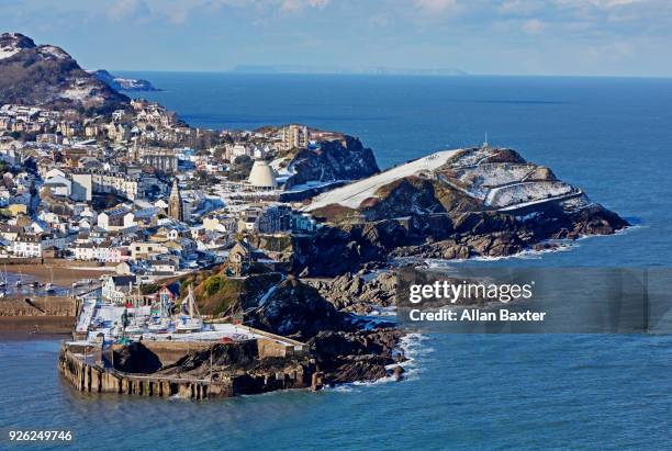 elevated view of the fishing village of ilfracombe after snow - ilfracombe stock-fotos und bilder