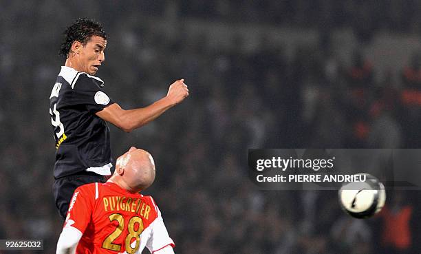 Bordeaux Moroccan forward Marouane Chamakh fights for the ball with Monaco's French defender Sébastien Puygrenier during their French L1 football...