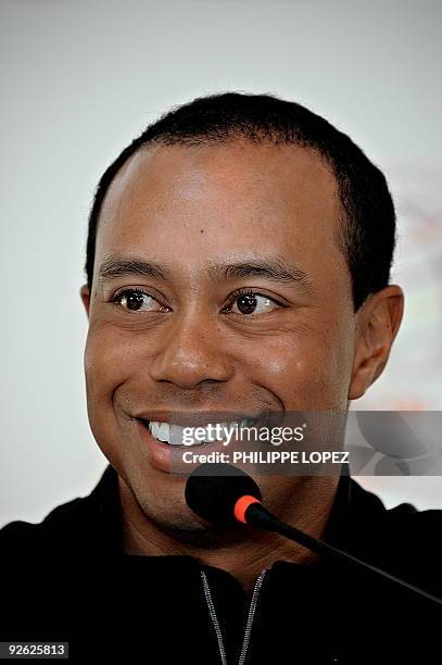 Golfer Tiger Woods smiles during a press conference in Shanghai on November 3, 2009 ahead of the HSBC Champions golf tournament, now elevated to...