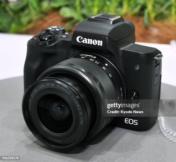 Photo taken on March 1 at a trade show in Yokohama, Japan, shows a Canon EOS Kiss M, part of a new range of mirrorless cameras. ==Kyodo