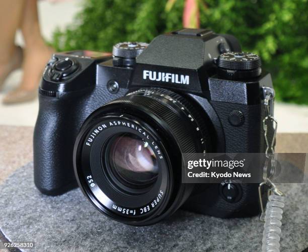 Photo taken on March 1 at a trade show in Yokohama, Japan, shows a Fujifilm X-H1, part of a new range of mirrorless cameras. ==Kyodo