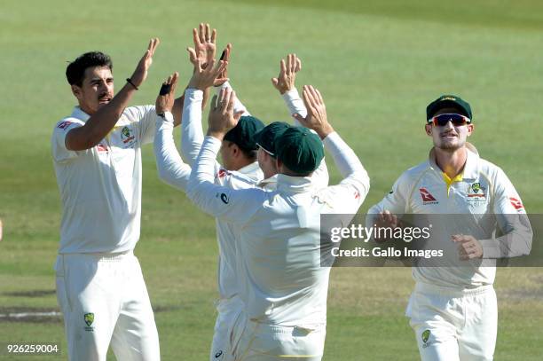 Mitchell Starc of Australia celebrates the wicket of Faf du Plessis of the Proteas with his team mates during day 2 of the 1st Sunfoil Test match...