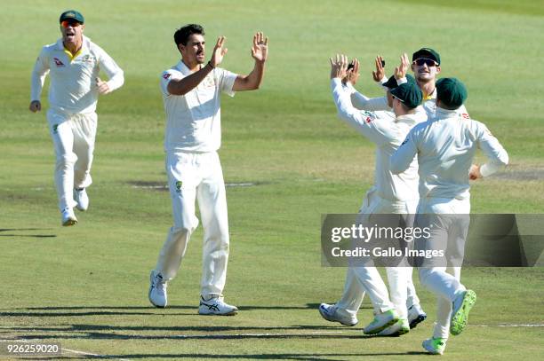 Mitchell Starc of Australia celebrates the wicket of Faf du Plessis of the Proteas with this team mates during day 2 of the 1st Sunfoil Test match...