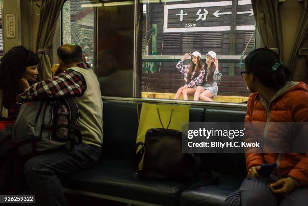 Tourists are seen on the train in Pingxi prior to the Sky Lantern Festival on March 1, 2018 in Pingxi, Taiwan. Pingxi, a Taiwanese district known for...