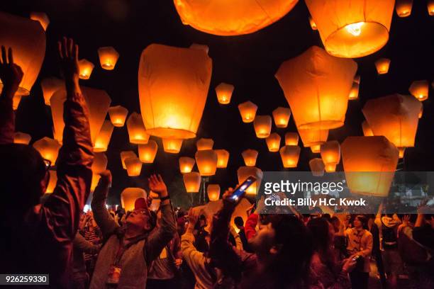 Tourists release sky lantern during the Pingxi lantern festival on March 2, 2018 in Pingxi, Taiwan. Pingxi, a Taiwanese district known for its old...