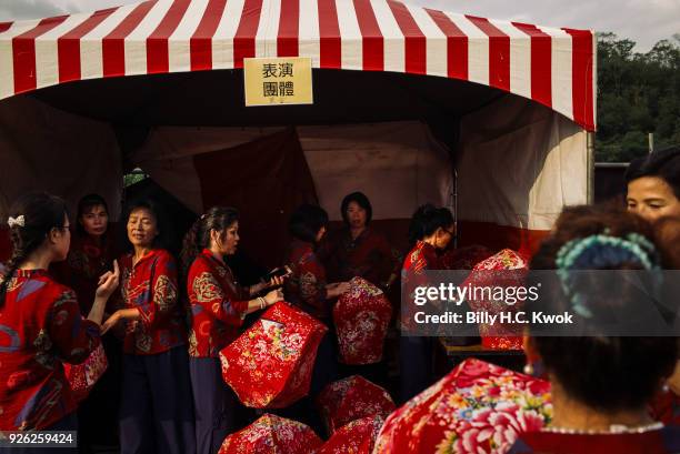 Performers prepare backstage before the Pingxi lantern festival on March 2, 2018 in Pingxi, Taiwan. Pingxi, a Taiwanese district known for its old...