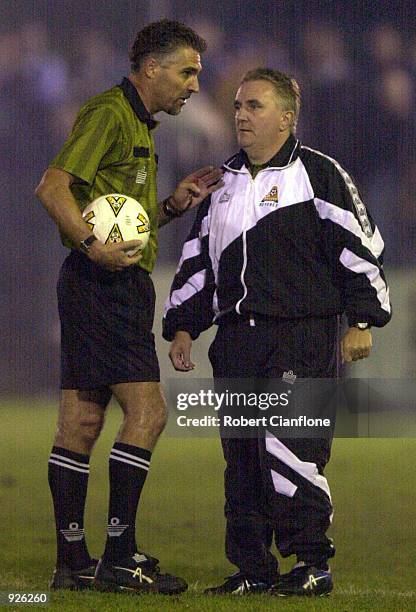 Referee Con Diomis consults with fourth official Gerry Connolly after a signal flare was shot above the stadium, during the NSL Elimination Final 1st...