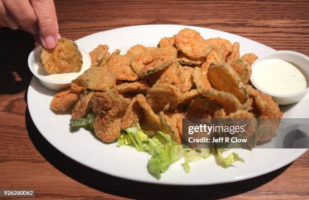 enjoying fried pickles 2 - ranch dressing stock pictures, royalty-free photos & images