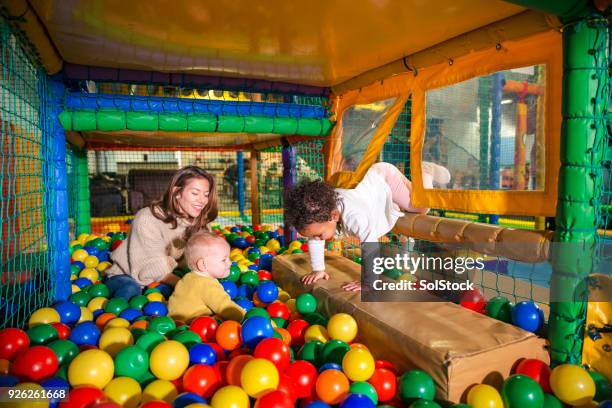 enjoying the ball pool - ball pit stock pictures, royalty-free photos & images