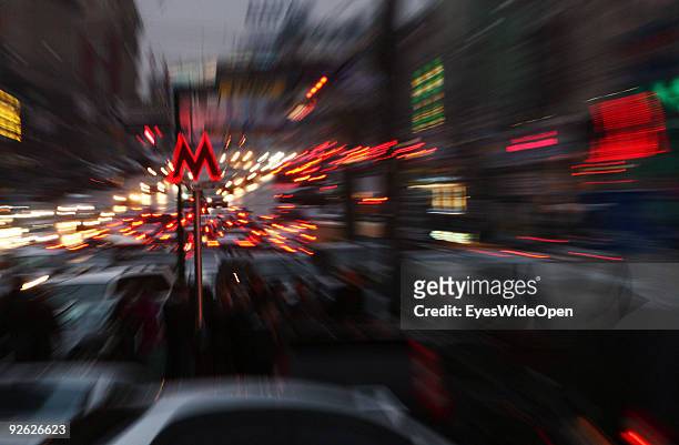 Enlighted Metro sign and traffic at rush hour around revolution square on October 14, 2009 in Moscow, Russia. Moscow is the biggest European City...