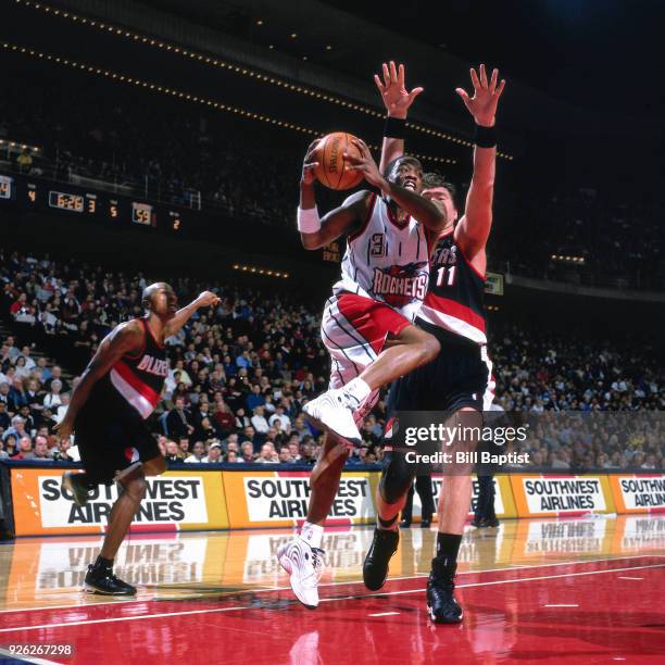 Steve Francis of the Houston Rockets drives during a game played circa 2000 at the Compaq Center in Houston, Texas. NOTE TO USER: User expressly...