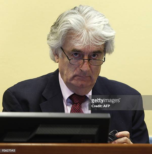 Wartime Bosnian Serb leader Radovan Karadzic appears in court for the International Criminal Tribunal in the Hague on November 3, 2009. Wearing a...