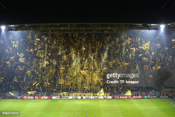 Supporters of Dortmund are doing a choreo with confetti prior to UEFA Europa League Round of 32 match between Borussia Dortmund and Atalanta Bergamo...
