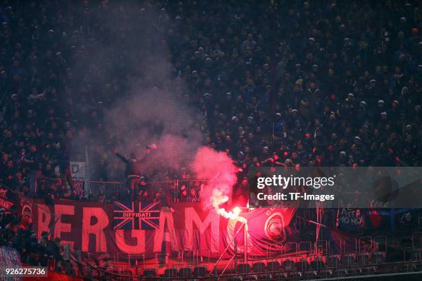 Supporters of Atalanta Bergamo are firing Bengalos prior to UEFA Europa League Round of 32 match between Borussia Dortmund and Atalanta Bergamo at...