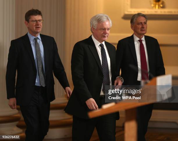 Business Secretary Greg Clark, Brexit Secretary David Davis and Chancellor Philip Hammond arrive to listen to a speech by Prime Minister Theresa May...