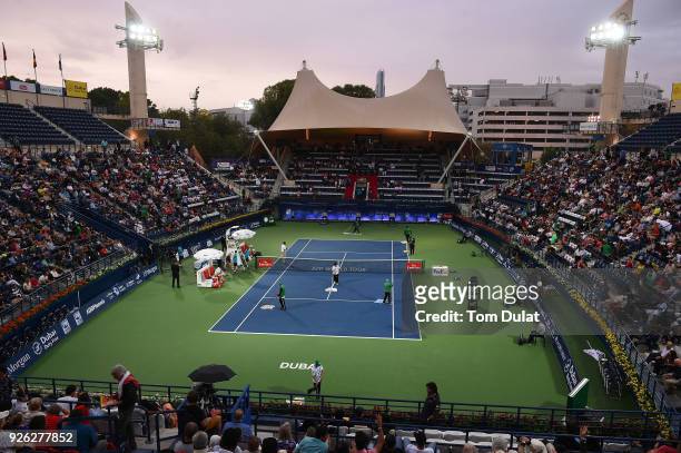 General view of the Centre Court being dried with towels during rain delay on day five of the ATP Dubai Duty Free Tennis Championships at the Dubai...