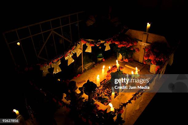 Faithful celebrate the Dia de los Muertos' at the Xilotepec cemetery on November 2, 2009 in Xochimilco, Mexico. Once a year, the Xilotepec cemetery...