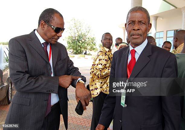 Guinean opposition leaders Alpha Conde and Jean-Marie Dore arrive for a meeting on November 3, 2009 in Ouagadougou. Burkina Faso's President Blaise...