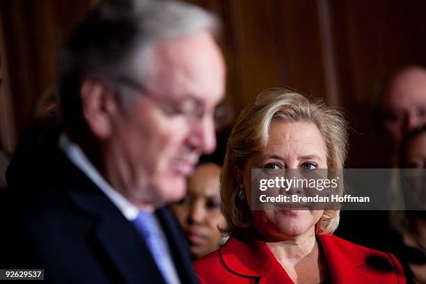 Sen. Mary Landrieu listens as Sen. Tom Harkin speaks at a news conference on health insurance reform and its impact on small businesses on November...