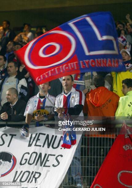Lyon's fans jubilate at the end of the French L1 soccer match Montpellier-Lyon, 20 may 2003, at the La Mosson stadium in Montpellier. The match ended...