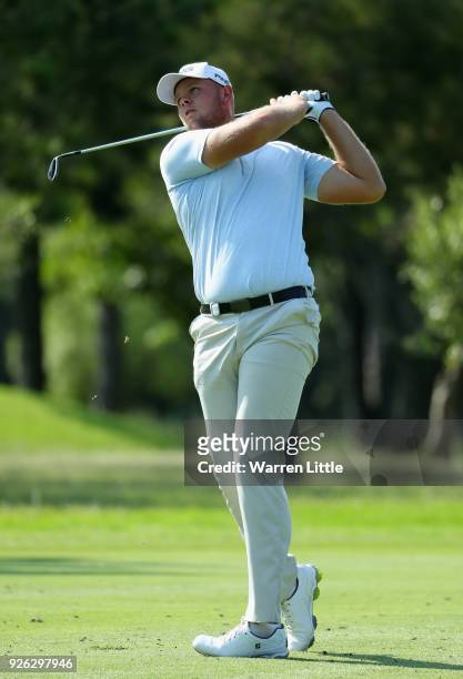 Jonathan Thomson of England plays his second shot into the sixth green during the second round of the Tshwane Open at Pretoria Country Club on March...