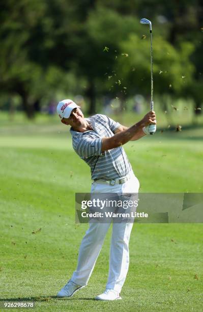 Louis De Jager of South Africa plays his second shot into the 11th green during the second round of the Tshwane Open at Pretoria Country Club on...