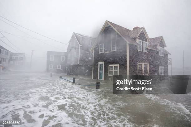 Lighthouse Rd. Begins to flood to during a large coastal storm on March 2, 2018 in Scituate, Massachusetts. A nor'easter is set to slam the East...