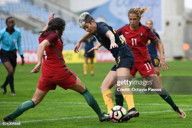 Tatiana Pinto of Portugal competes for the ball with Michelle Heyman of Australia during the Women's Algarve Cup Tournament match between Portugal...