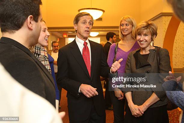 New Jersey Independent candidate for Governor Chris Daggett talks with voters as his wife Bea , daughters Alexandra and Justine listen after he cast...