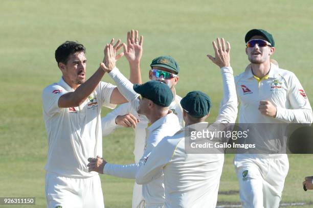 Mitchell Starc of Australia celebrates the wicket of Theunis de Bruyn of the Proteas with his team mates during day 2 of the 1st Sunfoil Test match...