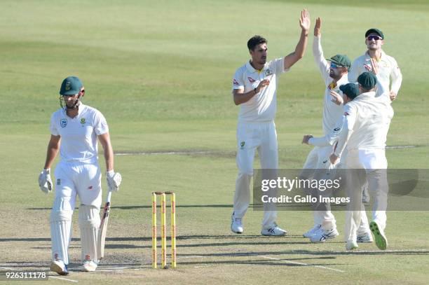 Mitchell Starc of Australia celebrates the wicket of Theunis de Bruyn of the Proteas with his team mates during day 2 of the 1st Sunfoil Test match...