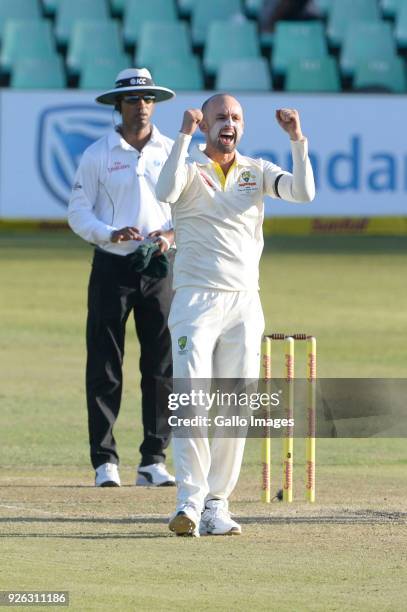 Nathan Lyon of Australia celebrates the wicket of Quinton de Kock of the Proteas during day 2 of the 1st Sunfoil Test match between South Africa and...