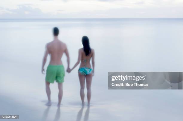 couple on the beach - st james barbados stockfoto's en -beelden