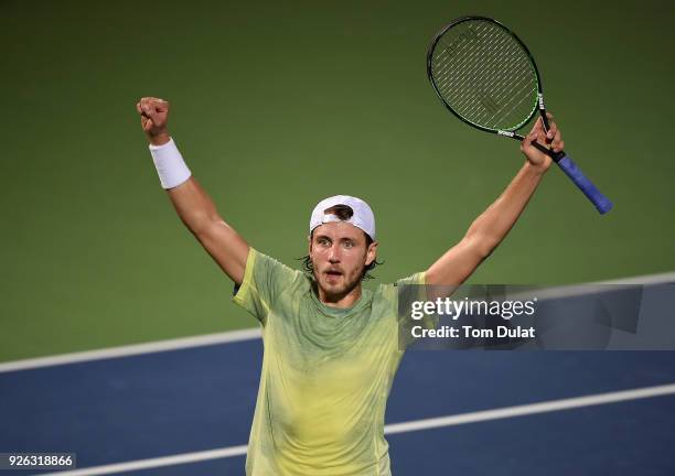 Lucas Pouille of France celebrates winning his semi final match against Filip Krajinovic of Serbia on day five of the ATP Dubai Duty Free Tennis...