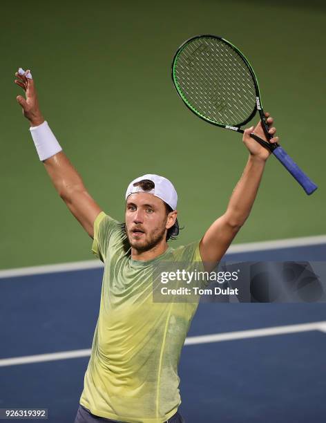 Lucas Pouille of France celebrates winning his semi final match against Filip Krajinovic of Serbia on day five of the ATP Dubai Duty Free Tennis...