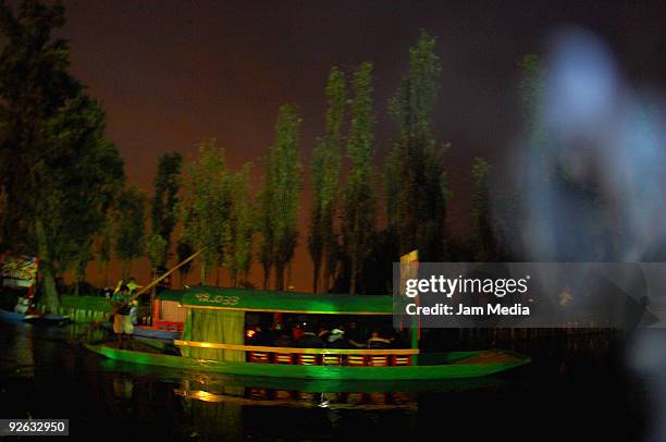 View of a 'trajinera' ship during 'La llorona' performance, based upon a Mexican legend, as part of the Day of the Dead celebrations at Xochimilco...
