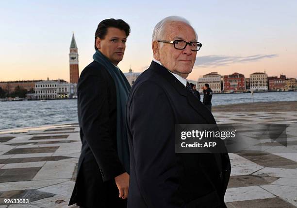 French fashion designer Pierre Cardin and his son Rodrigo arrive in Venice on November 3, 2009 to attend a concert on the occasion of the donation by...