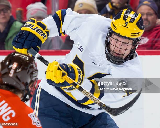 Cutler Martin of the Michigan Wolverines passes the puck against the Bowling Green Falcons during game two of the Great Lakes Invitational Hockey...