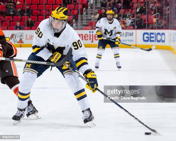 Dexter Dancs of the Michigan Wolverines controls the puck against the Bowling Green Falcons during game two of the Great Lakes Invitational Hockey...