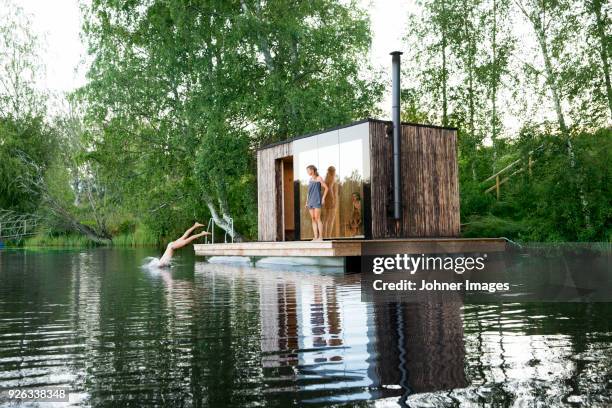 sauna at lake - young boy in sauna stock pictures, royalty-free photos & images