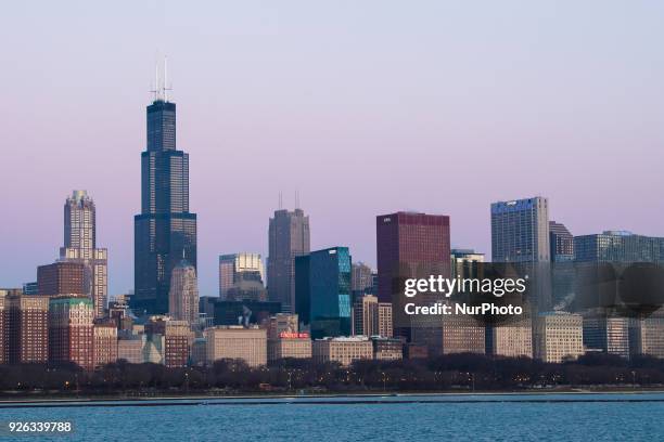 Views of the sun rising to illuminate the Chicago skyline from the Adler Planetarium on March 2, 2018.