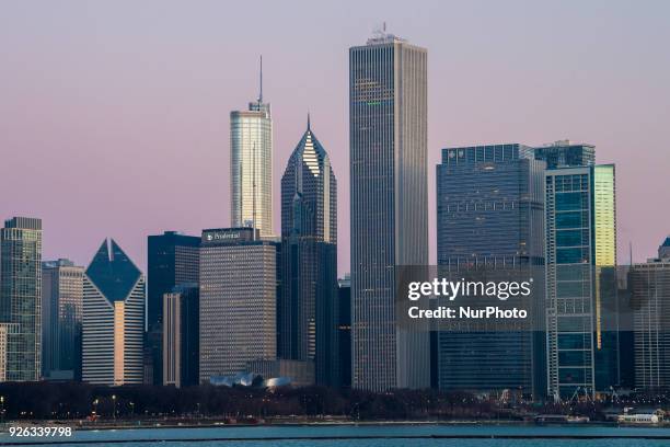 Views of the sun rising to illuminate the Chicago skyline from the Adler Planetarium on March 2, 2018.