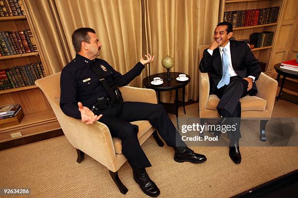 Los Angeles Mayor Antonio Villaraigosa speaks with Deputy LAPD Chief Charlie Beck as they enjoy coffee and chat together at Getty House; the Mayors...