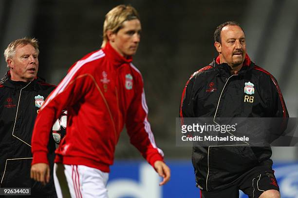 Rafael Benitez the Liverpool manager and assistant Sammy Lee look on as Fernando Torres trains during the Liverpool training session, ahead of the...